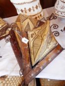 Two Moroccan wrought metal and polychrome decorated goatskin and henna lampshades,
