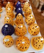 Moroccan brightly glazed pierced pottery candle covers