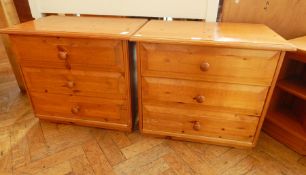 A pair of pine three drawer chests,