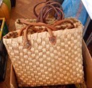 A quantity of Moroccan graduated sets of three baskets with leather handles