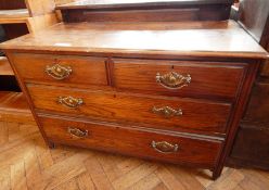 A dressing table with two short and three long drawers, on tapering legs,