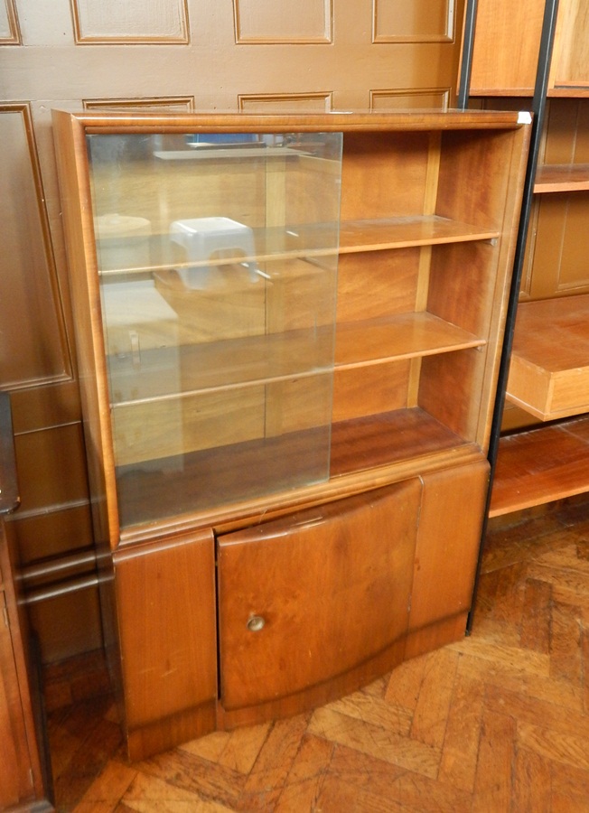 A 20th century bookcase with glass sliding doors, and bow front cupboard below, - Image 3 of 3