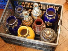 A quantity of Moroccan brightly coloured glazed and decorative silver-mounted vases and caskets (2