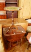 A stained oak gateleg table, a small tripod table with fluted decoration,