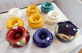 A quantity of Moroccan brightly coloured glazed pottery ashtrays,