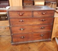 A Victorian mahogany chest of two short and three long graduated drawers, on shaped bracket feet,