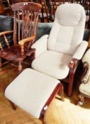 A upholstered reclining chair and stool