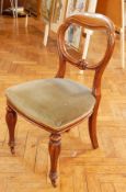 A set of four Victorian mahogany balloon back chairs, with carved splat,