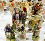 Large group of Staffordshire figures and spill vases