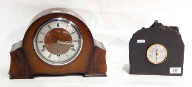 A Smiths oak cased mantel clock with silvered chapter ring,