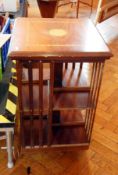 An Edwardian mahogany revolving bookcase with inlaid satinwood top,