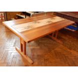 A contemporary Danish rectangular tiled top dining table on twin column supports united by