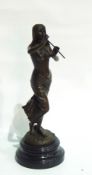 Bronze figure of semi-draped female playing pan-pipes, having foundary stamp,