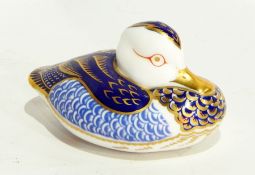 A Royal Crown Derby paperweight in the form of a duck with silver stopper
