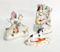 A Staffordshire small spill vase with sheep (7cms), a ceramic spaniels seated on a cushion,