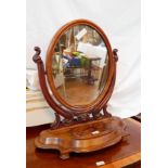 A Victorian mahogany oval swing frame dressing table mirror on carved supports,