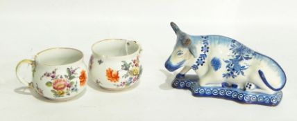 Two 19th century Meissen porcelain cups handpainted with floral sprays and Delft pottery model cow