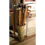 Large collection of walking sticks with animal heads to include carved, brass coloured metal,