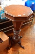A 19th century octagonal occasional table on octagonal tapering and bun supports,