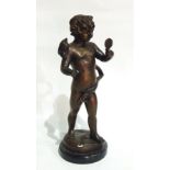 Bronze figure of Putto holding hand mirror on black circular marble plinth,