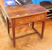 An 18th century oak rectangular top low boy with moulded edge, frieze drawer,