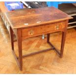 An 18th century oak rectangular top low boy with moulded edge, frieze drawer,