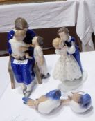 A Copenhagen porcelain figure of mother sitting with child on lap and to side,