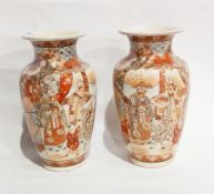 A pair of Japanese vases, painted and with enamel overlay,