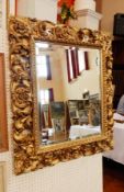 Gilt carved wood mirror,
