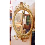 A Georgian style giltwood girandole mirror with carved foliate decoration,