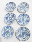 A set of six Ch'ing dynasty plates with underglaze, blue lotus blossom decoration,