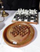 A marble and hardstone chess board together with a wooden solitaire board