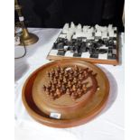 A marble and hardstone chess board together with a wooden solitaire board