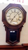 American stained wood drop dial wall clock with Roman numerals to the dial and glazed lower case