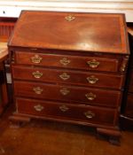 A George III mahogany bureau, with crossbanding,