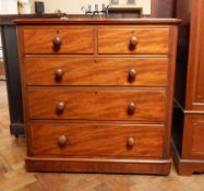 A Victorian mahogany chest of two short and three long graduated drawers, on block plinth,
