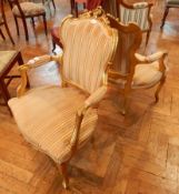 A pair of French Louis Filippe XV style gilt chairs, with C-scroll crest rail,