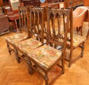 A set of six stained beech Ercol Colonial high back dining chairs, with turned splats,
