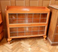 A two-tier Globe Wernicke style bookcase on claw and ball feet,