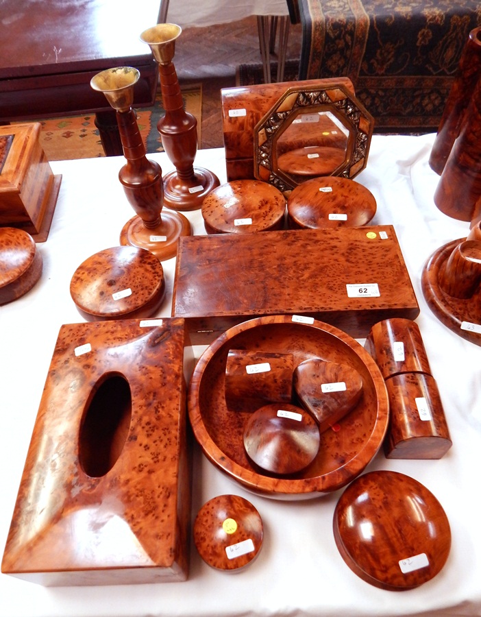 A pair of Moroccan thuya wood turned candlesticks, a backgammon board,