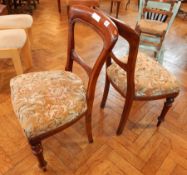 A pair of Victorian mahogany balloon back dining chairs with carved splat,