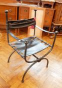 A contemporary black painted steel armchair, with leather back support and seat,
