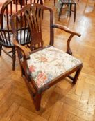 An old early 19th century mahogany armchair with open splat back, upholstered drop in seat,