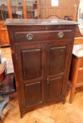 An Edwardian mahogany sheet music cabinet with one drawer above panelled cupboard doors,