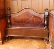 A Victorian mahogany serpentine shaped headboard with block and pear supports, with footstead,