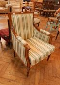 A square back armchair, with upholstered back, loose cushion seat with padded arms,