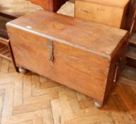 An oak coffer with brass clasp and lock,