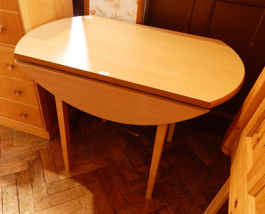 A pine drop-leaf dining table,