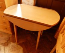 A pine drop-leaf dining table,