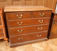An oak chest of drawers with two short and three long drawers, on plinth base,